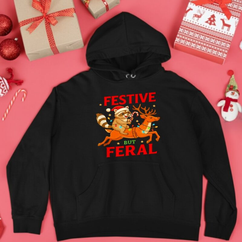Festive But Feral Christmas Raccoon Riding Reindeer_Hoodie
